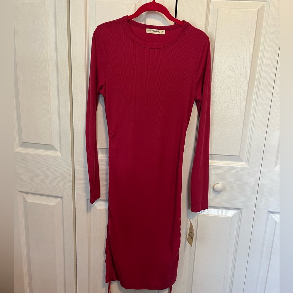 Fuchsia long sleeve with cinchabke sides .